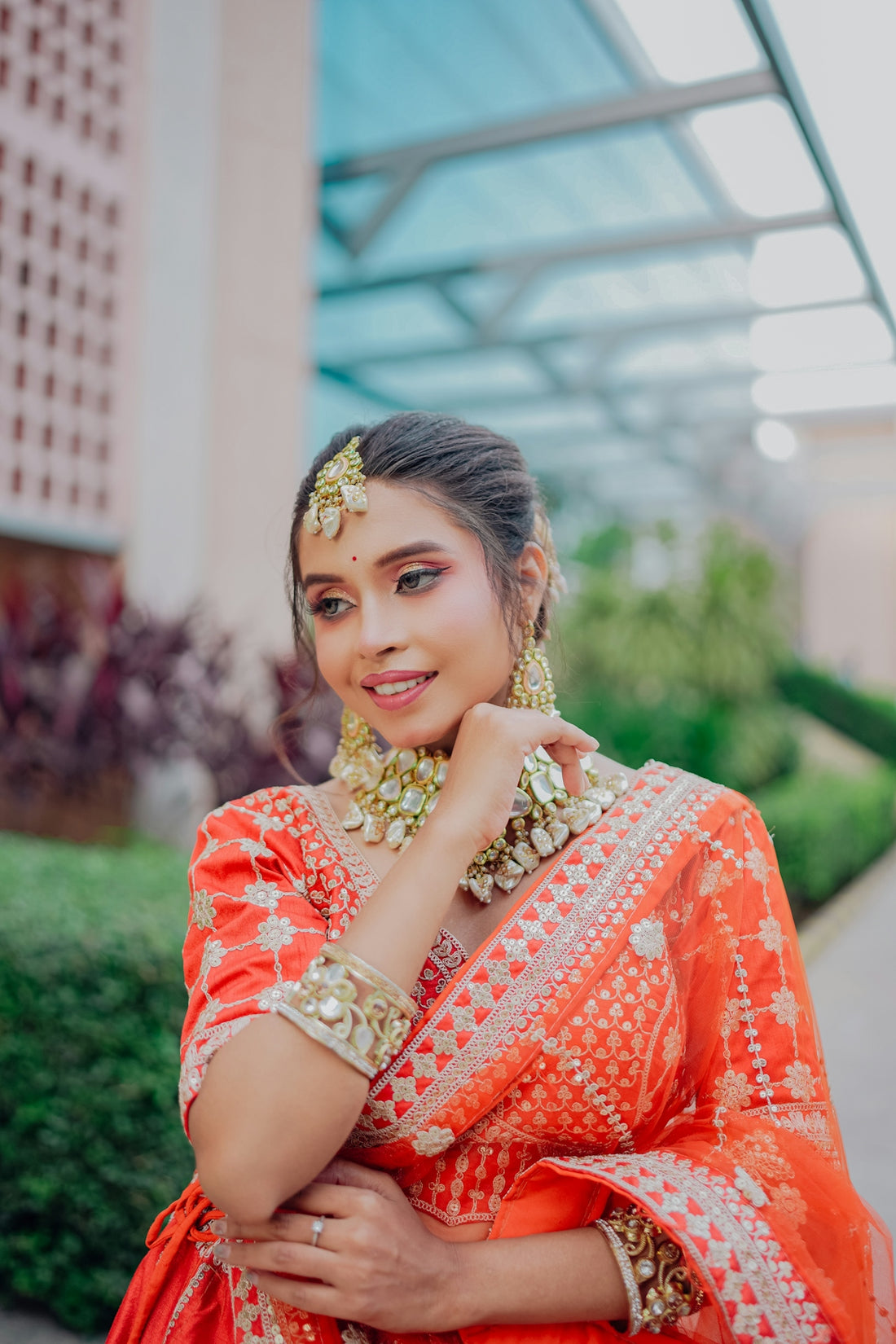 A woman in traditional indian attire smiles gently.