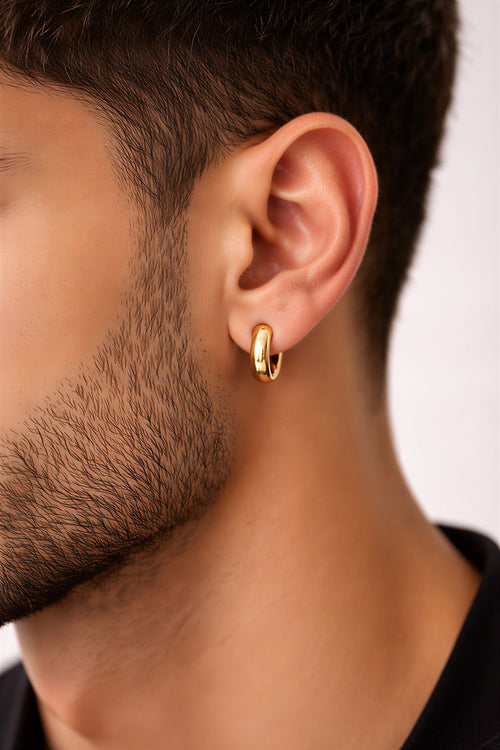 mens ear wearing gold plated huggie hoop earring lifestyle view