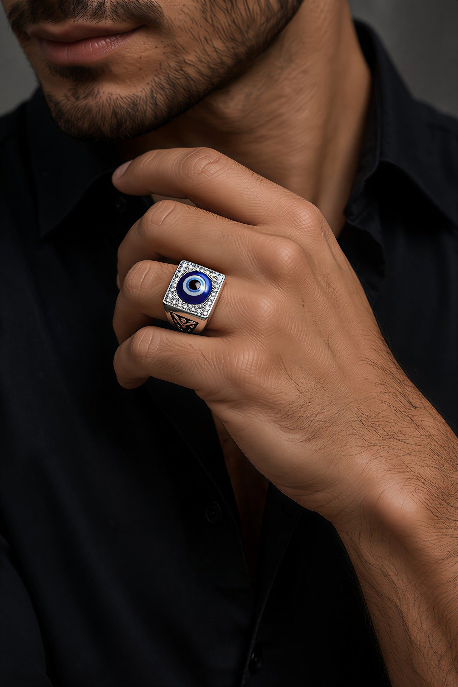 Oxidised stainless steel evil eye ring for men with blue nazar design worn on finger, stylish statement ring for boys