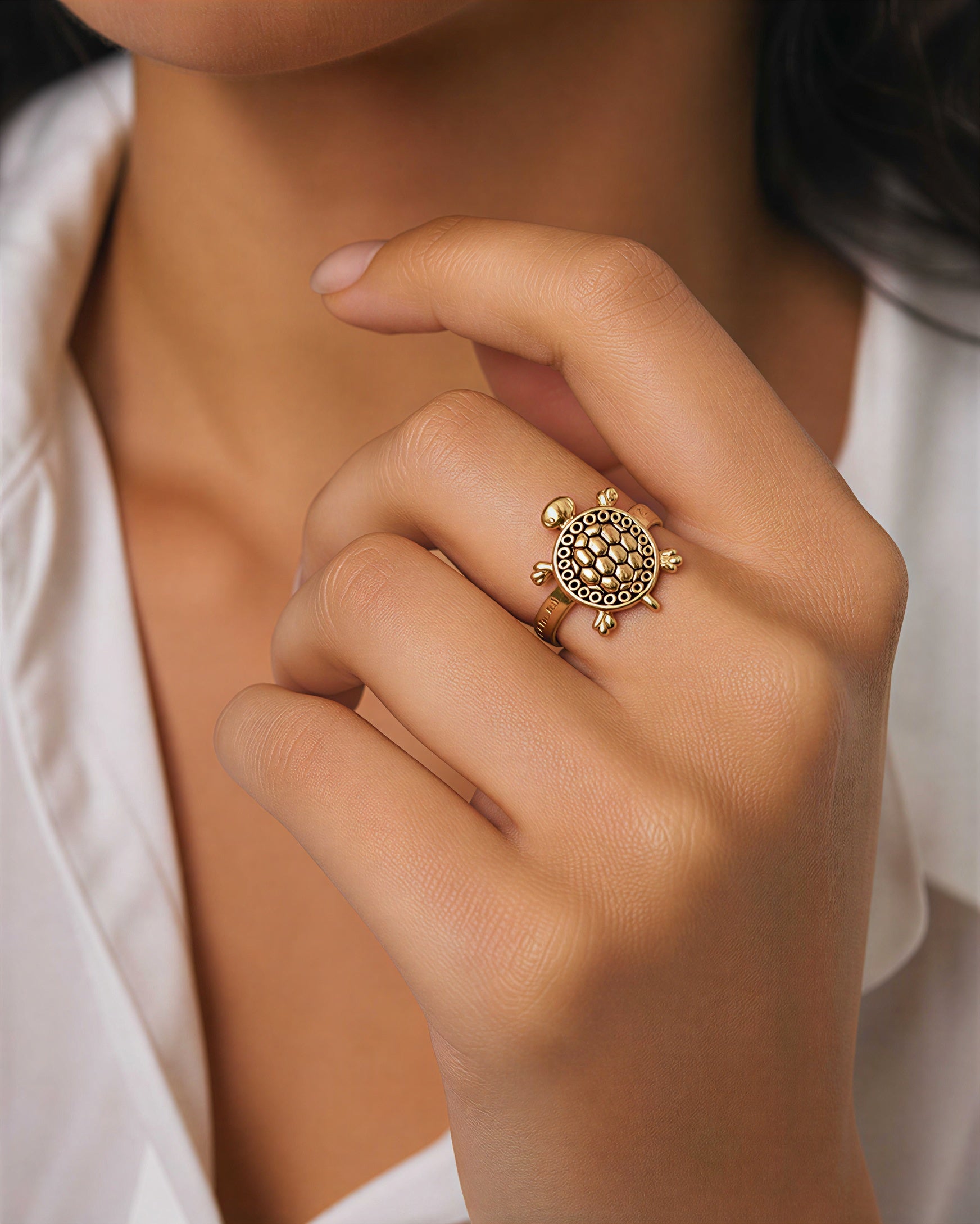 Woman wearing adjustable gold turtle ring elegant fashion jewelry lifestyle image