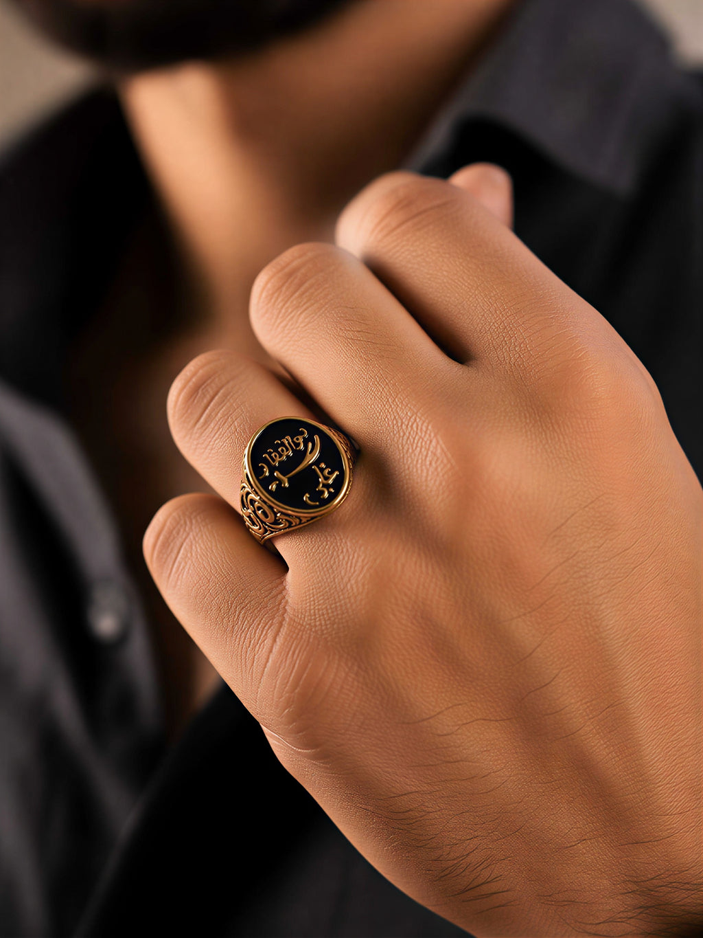 mens arabic ring gold plated worn on hand closeup jewellery styling
