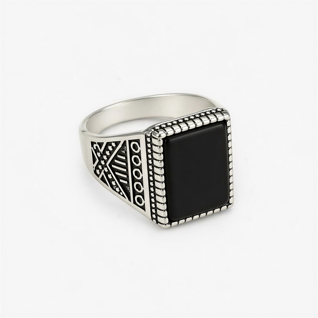 Front view of vintage oxidised black stone signet ring for men with engraved silver design