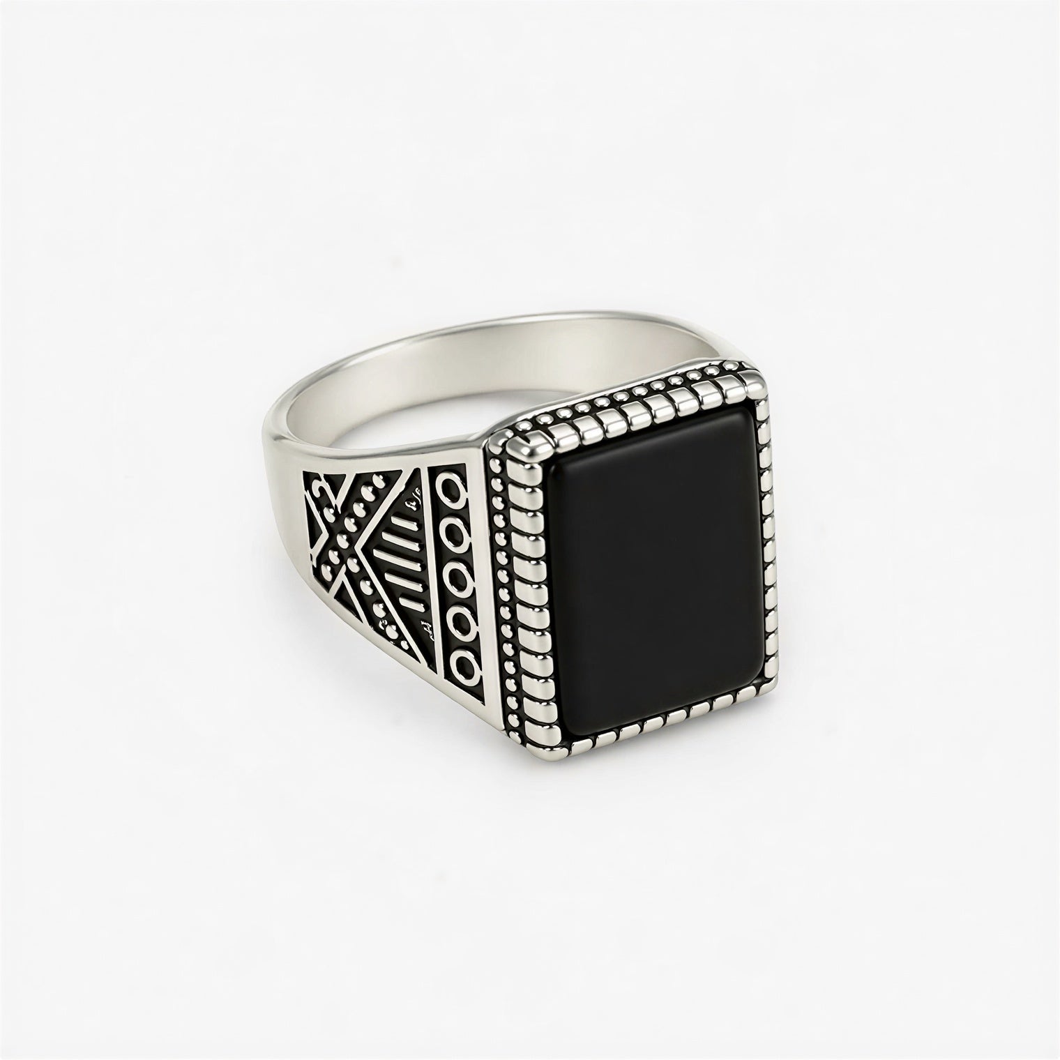 Front view of vintage oxidised black stone signet ring for men with engraved silver design